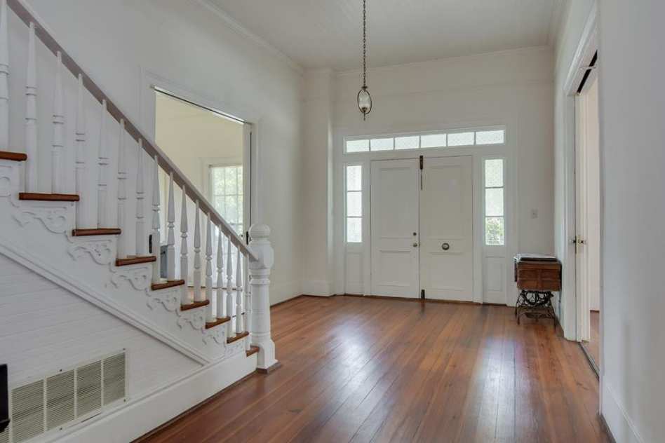1888 Victorian Home - Johnston, South Carolina -- Love the scriptions on the stairs. Bright and cheery.